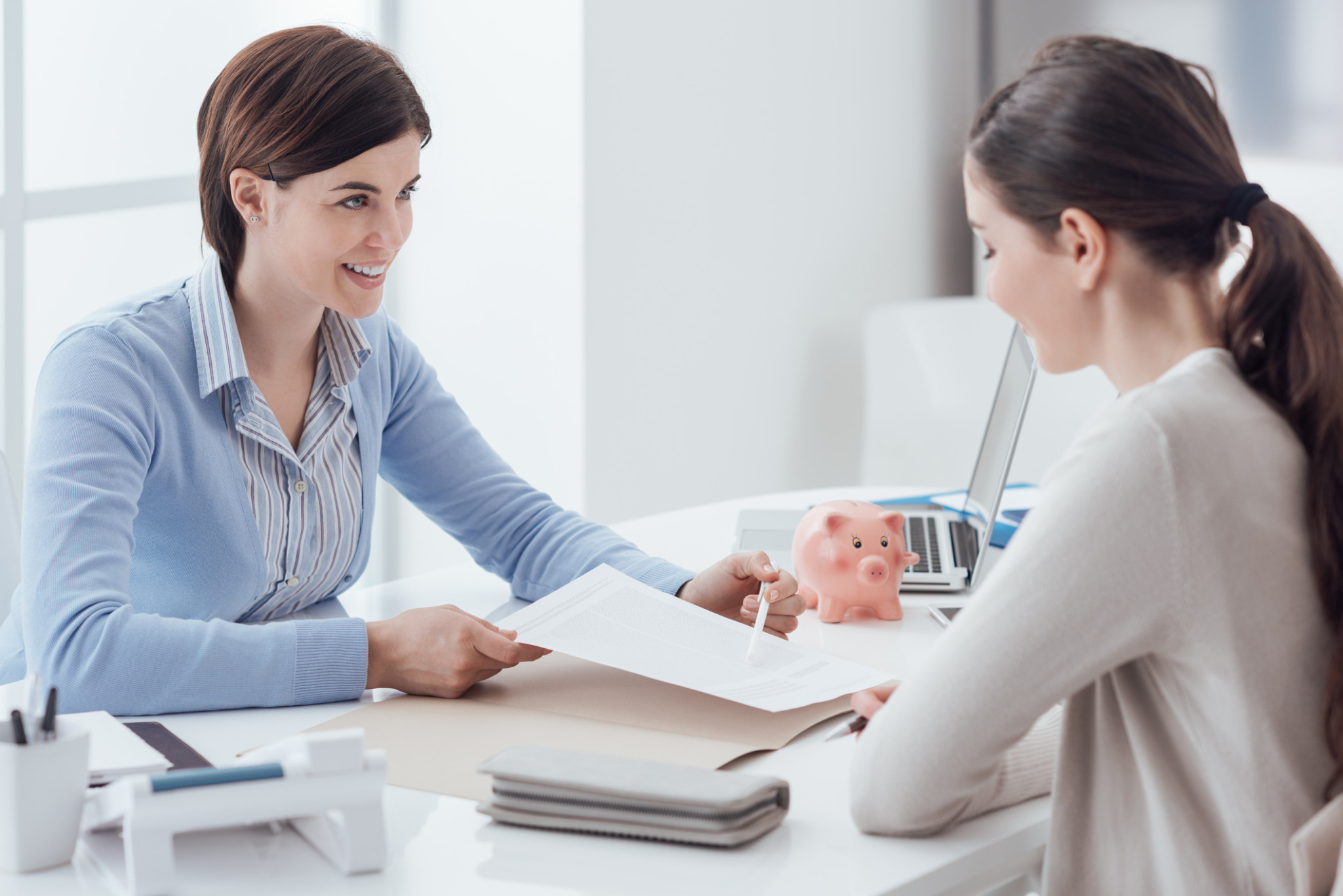Financial planning Business consultant and customer meeting in the office, the businesswoman is holding a contract and pointing